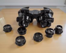 A pair of jeweler's magnification spectacles with various lenses.