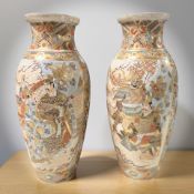 A pair of Japanese Satsuma earthenware baluster vases, height 36 cm.
