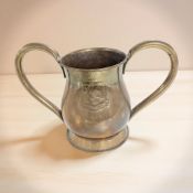 A brass twin-handled vessel with the crest of the city of Liverpool, height 20 cm.