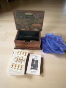 A mahogany box containing tarot cards.