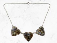 A silver and mother of pearl heart-shaped necklace