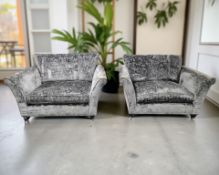 A pair of contemporary two seater settees in grey floral fabric, each 156 cm x 107 cm x 105 cm.