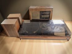 A Dynatron teak cased music centre, a pair of Philips teak speakers and a walnut cased valve radio.