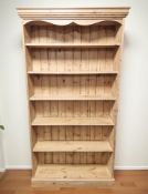 A modern pine open bookcase, 98 cm x 28 cm x 185 cm.