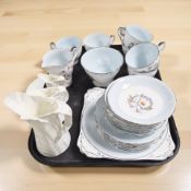 Twenty one pieces of Royal Stafford White Lady tea china, and three Royal Worcester graduated jugs.