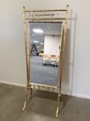 A gilt metal bamboo effect cheval mirror, height 178 cm.
