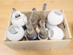 A group of antique oil lamps.