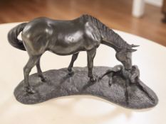 A bronzed-resin figure group of a horse and foal, length 37 cm.