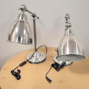 A pair of modern angle poised lamps.
