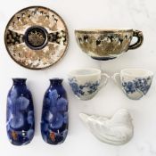 Japanese porcelain to include a Meiji period Satsuma earthenware tea cup and saucer, signed to base,