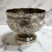 A Victorian embossed silver pedestal bowl, Walker & Hall, Sheffield 1898,