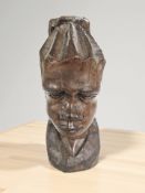 An African carved hardwood bust, height 29 cm.