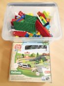 A Playtive Junior toy railway set, in box, and a further box containing building blocks.