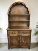 A reproduction carved oak Dutch dresser, 92 cm x 44 cm x 178 cm.