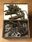 A collection of antique clock and pocket watch keys.