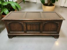 A 20th century oak linen fold blanket chest, 122 cm x 49 cm x 53 cm.