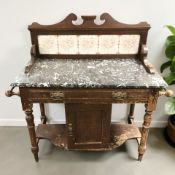 A late Victorian pine marble-topped wash stand with tiled back, 107 cm x 47 cm x 103 cm.