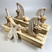 A pair of Empire style painted gilt wood and gesso table supports in the form of winged sphinxes,