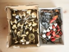 A quantity of brass and other door knobs and draw pulls, etc.