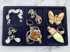 A group of silver/white metal gem-set jewellery including amber, polished hardstone,