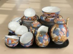 Forty pieces of Japanese egg shell tea porcelain.
