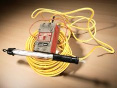 An industrial flame proof lead lamp assembly with transformer.