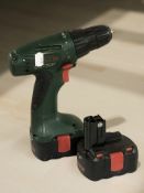 A Bosch cordless drill with two batteries.