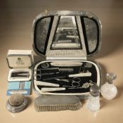 Two silver-mounted dressing table bottles, similar brush and pin cushion, a boxed Ronson lighter,
