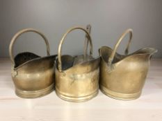Three Victorian brass coal helmets.