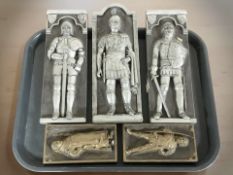 Five Marcus Designs ceramic plaques depicting knights, a Roman, Robin Hood and Friar Tuck.