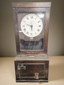An oak cased Gledhill-Brook Time Recorders Limited clocking-in machine, height 100 cm.
