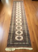 A Lahore Bokhara runner, Pakistan, 332 cm x 80 cm.