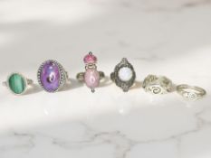 Six silver/white metal dress rings,