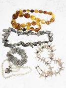 A group of abelone, pearl and simulated amber beads.