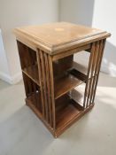 An Edwardian mahogany and satinwood inlaid revolving book table, 49 cm W x 77 cm H.
