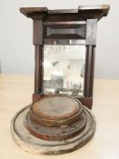 A 19th century mahogany wall mirror, width 64 cm, and three wooden circular stands / plinths.