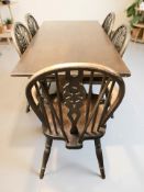A reproduction oak 5 ft refectory dining table, together with a set of five wheelback chairs.