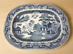 A 19th century Opaque China blue and white willow pattern meat plate, width 45 cm.
