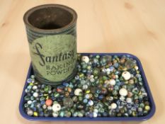 A Fantasy baking powder tin and a large quantity of antique / vintage marbles.