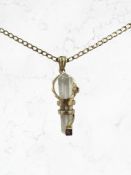 A gold-mounted crystal pendant on chain, set with an amethyst and a citrine, stamped 375/9Kt.