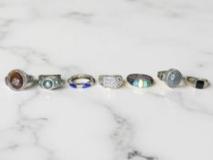 Seven silver/white metal dress rings, set with tanzanite, faux opal,