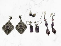 Four pairs of silver/white metal earrings including amethyst