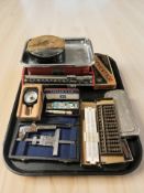 A set of West German enameled scales, a small abacus, slide rule, safety razors,