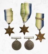 A group of World War II medals including three Atlantic stars, one with France and Germany clasp.