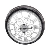 A decorative quartz wall clock, diameter 61 cm.
