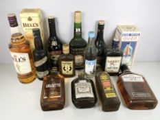 Thirteen bottles of alcohol including Bells Scotch whisky, Baileys, Lambs Navy rum,