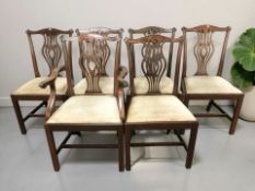 A set of six reproduction mahogany dining chairs comprising one carver and five singles.