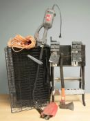 An electric strimmer (continental plug) together with an axe, a folding dog cage,