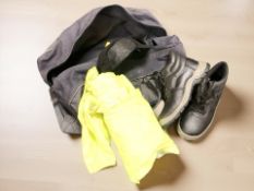 A vintage RAF holdall containing a pair of new safety boots, size 11,