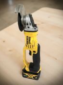 A DeWalt DCG412 cordless angle grinder with battery pack.